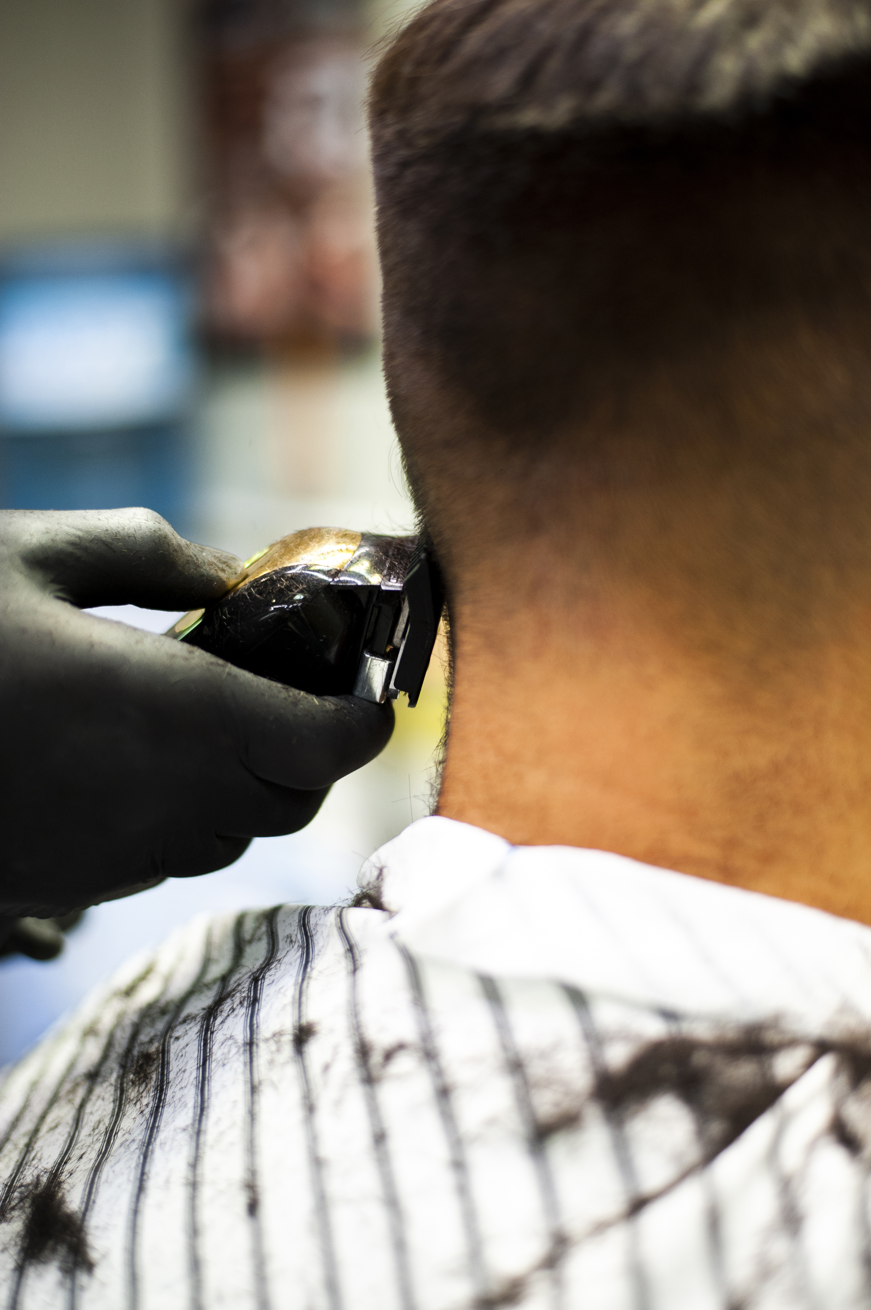 Barber performing a fade haircut